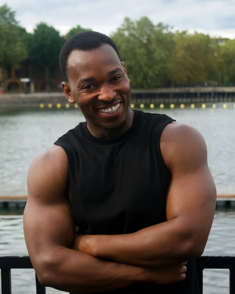 James, personal trainer in London, smiling by the river